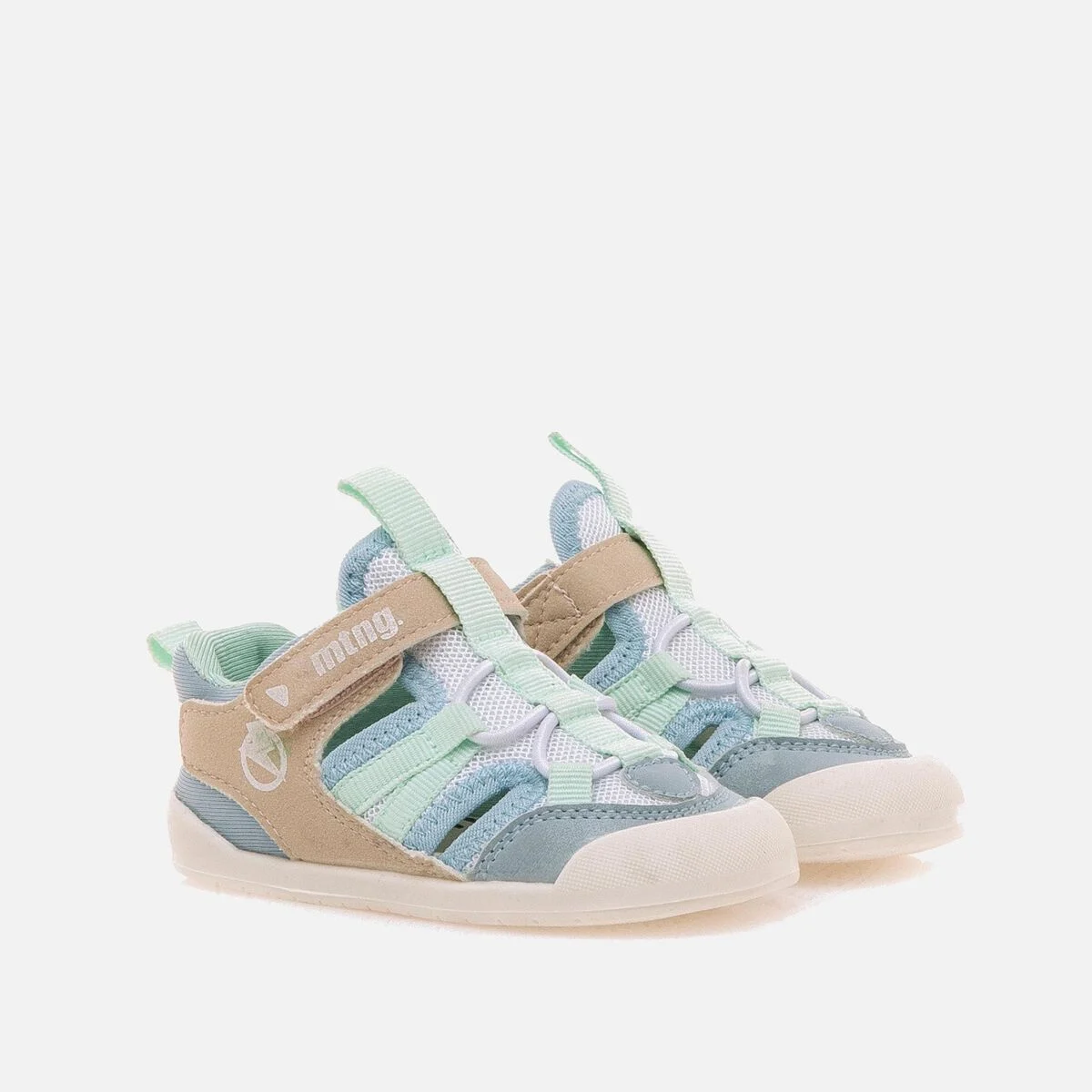 Sandalia deportiva Mustang en tonos rosa, celeste y beige, con suela flexible y ajuste de velcro, ideal para niños pequeños.