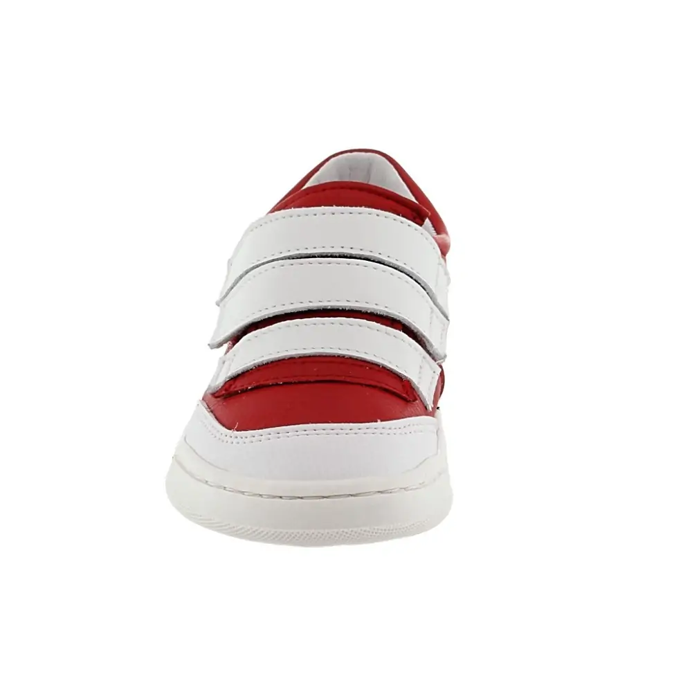 Vista de la suela de la zapatilla respetuosa Blandy Shoes Valery en color rojo y blanco, diseño ergonómico que favorece el desarrollo natural del pie.