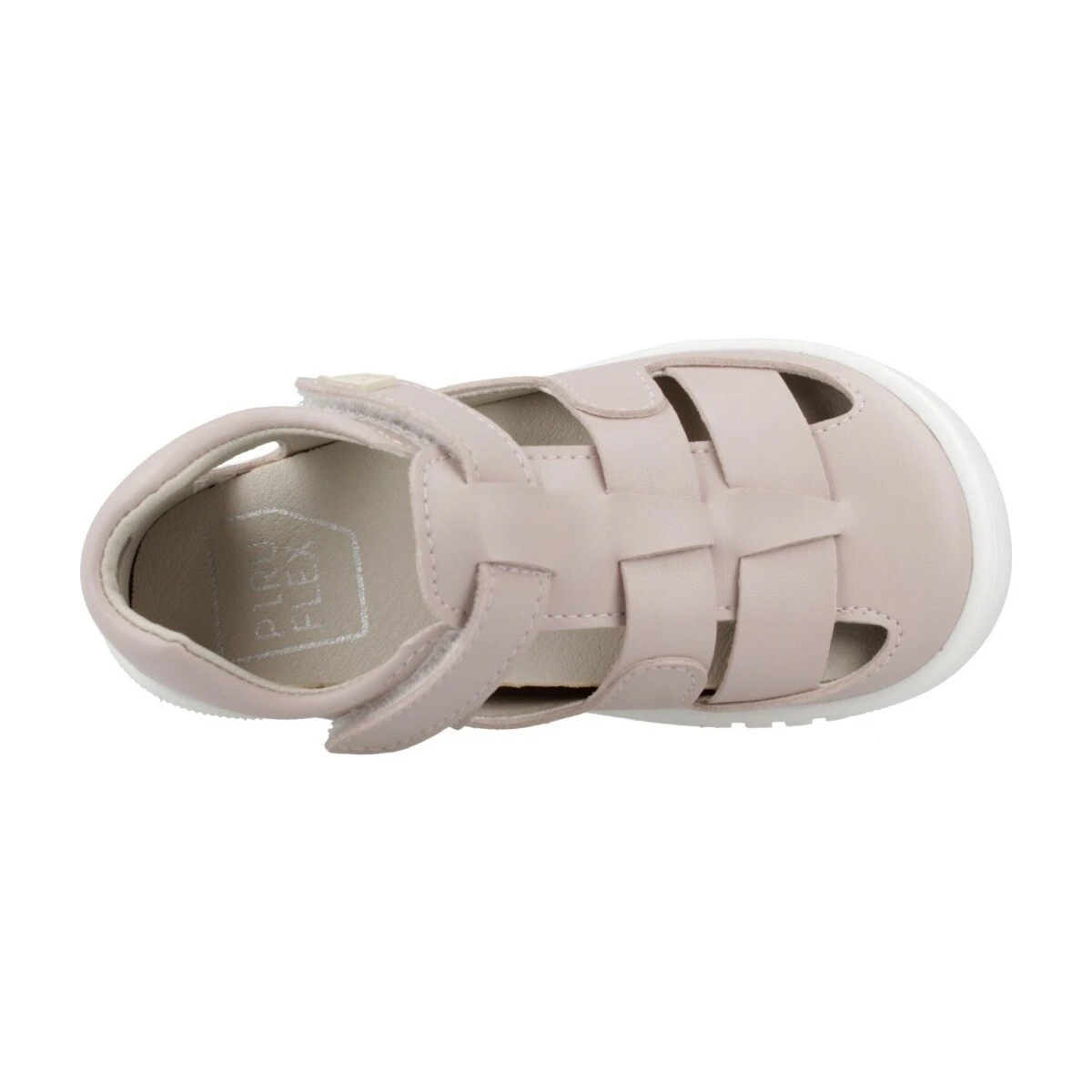 Vista superior de las sandalias respetuosas Piruflex 4 rosa en uso por un niño, mostrando ajuste ergonómico, puntera libre y suela plana para libertad de movimiento.